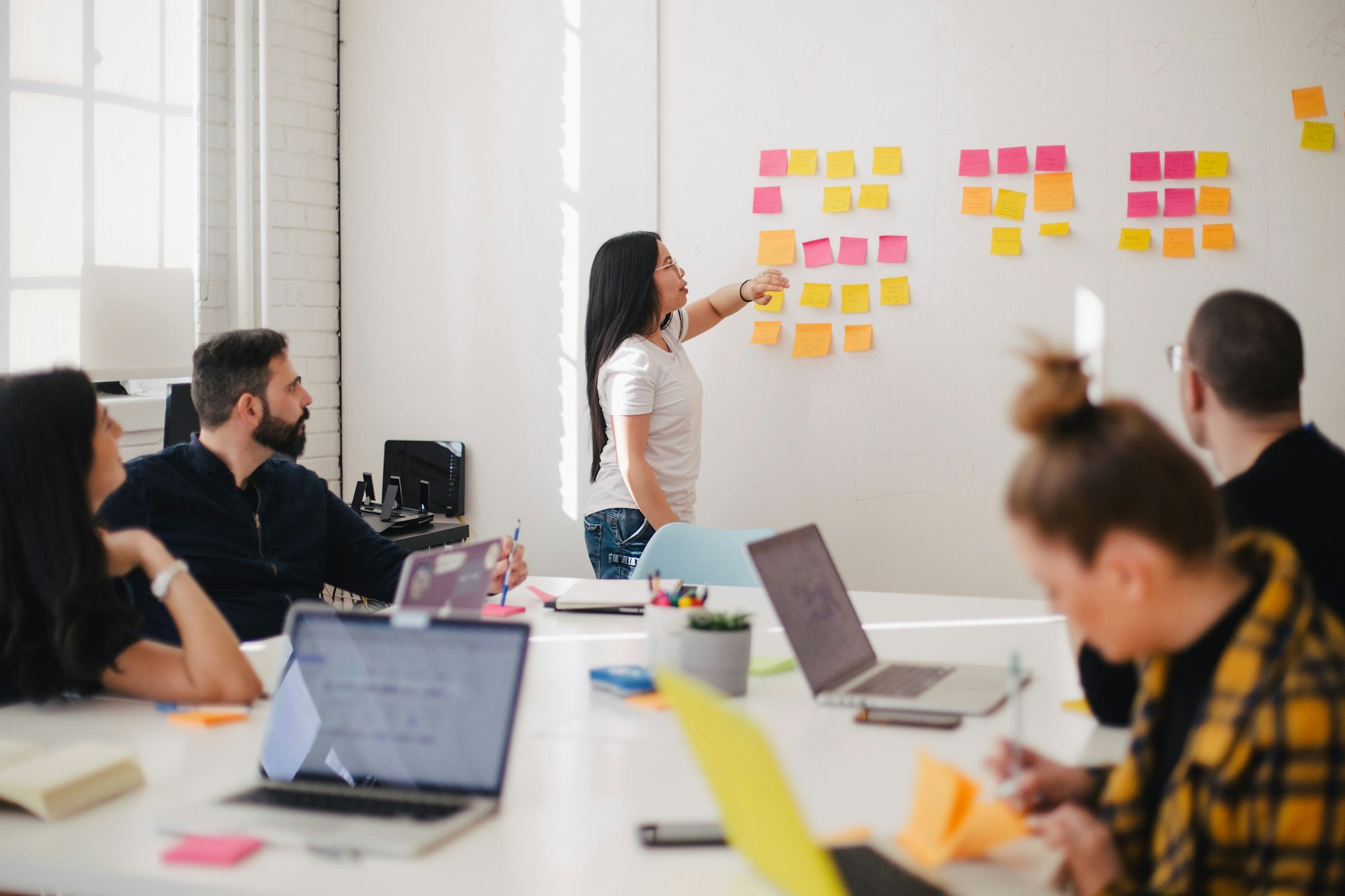Creative team reviewing brand campaign materials in a modern studio